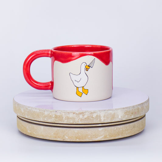 kubek kaczka z nożem